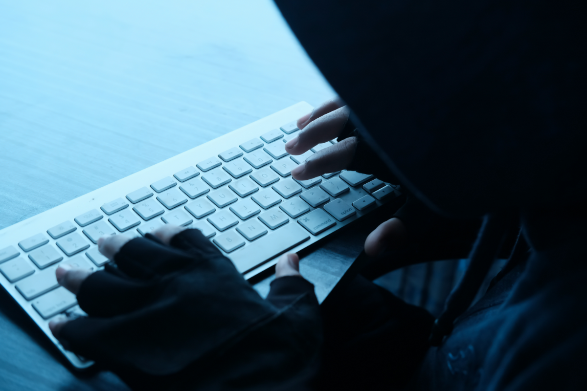 hackers hand in keyboard